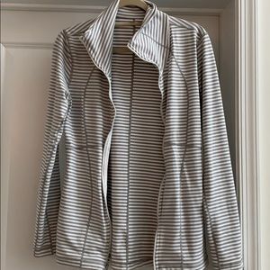 Grey and white Reebok zip up